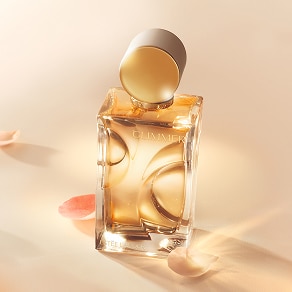 photo of woman applying long lasting fragrance from estee lauder