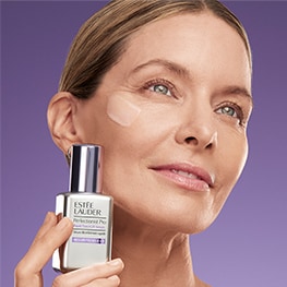 photo of estee lauder model with perfectionist pro firm + lift serum for firming skin