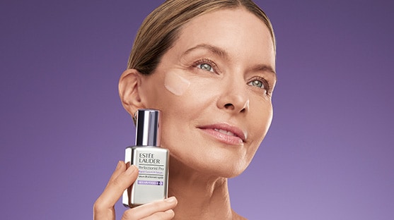 photo of estee lauder model with perfectionist pro firm + lift serum for firming skin