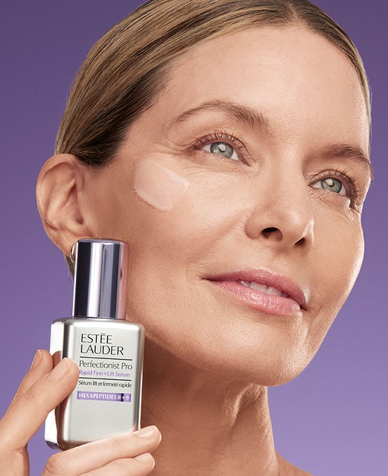 photo of estee lauder model with perfectionist pro firm + lift serum for firming skin