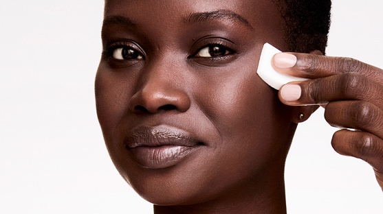 photo of woman applying double wear stay in place foundation that balances oil and hydration in skin