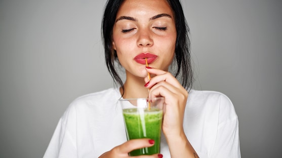 photo of woman drinking longevity smoothie